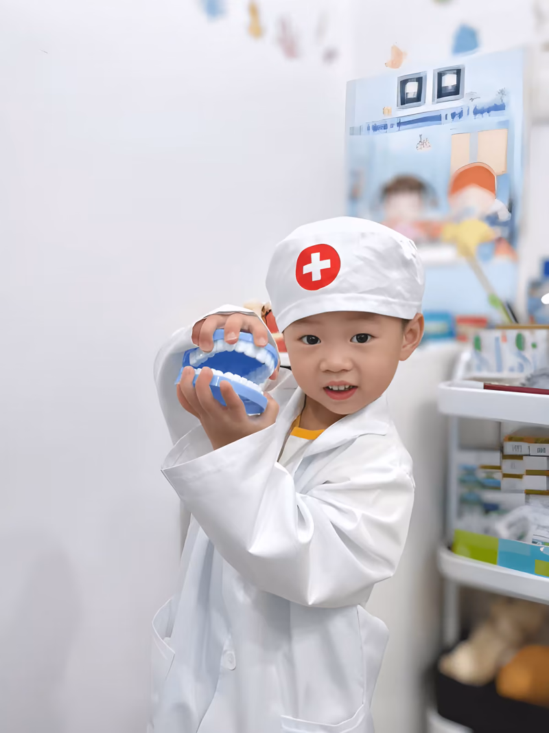 Happy child dressed as a dentist during a fun and friendly kids dental visit.
